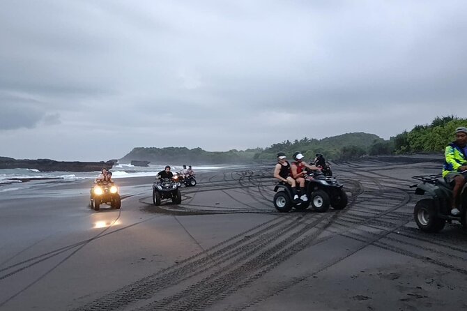 Bali ATV Ride In the beach sunset atv tour - Riding Bali’s black-sand coast near Tegal Mengkeb