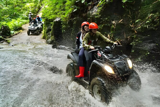 Bali Ayung River Rafting And Bali Quad Bike Packages - Ayung River rafting with carvings and a waterfall