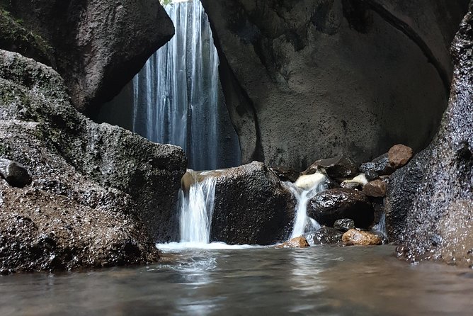 Bali Instagram Tour : Heaven Gate Tour - Tirta Gangga - Tukad Cepung Waterfalls - Tirta Gangga’s fountains, fish, and stone paths