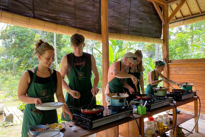 From Ubud: Authentic Bali Farm Cooking School & Organic Farm - Picking vegetables in an organic farm garden