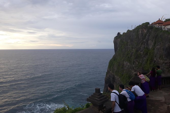 Half Day Uluwatu Temple And Kecak Dance Private Guided Tour - Walking through the temple with monkey precautions