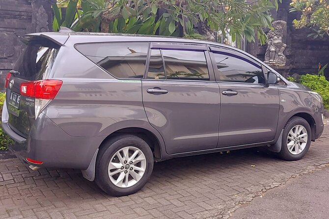 Ngurah Rai International Airport Private Arrival Transfer - Area D: Echo Beach, Batu Belig, Munggu, and Tanah Lot