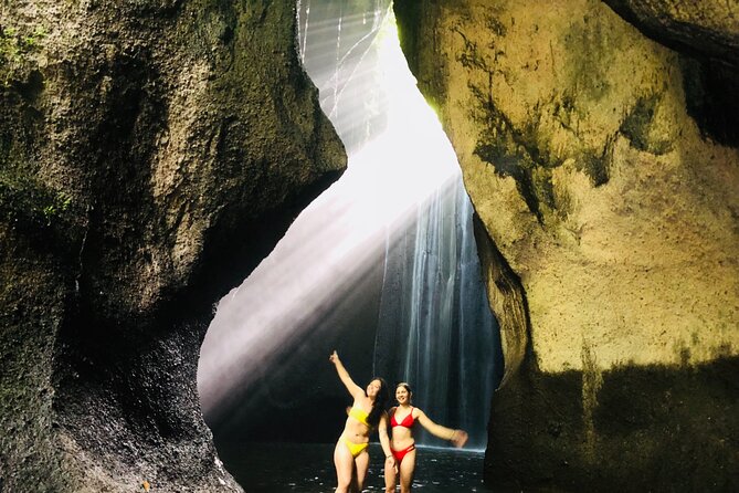 Ubud Temples, Waterfalls, Rice Terraces & Balinese Culture - Tukad Cepung Waterfall beneath the rock opening
