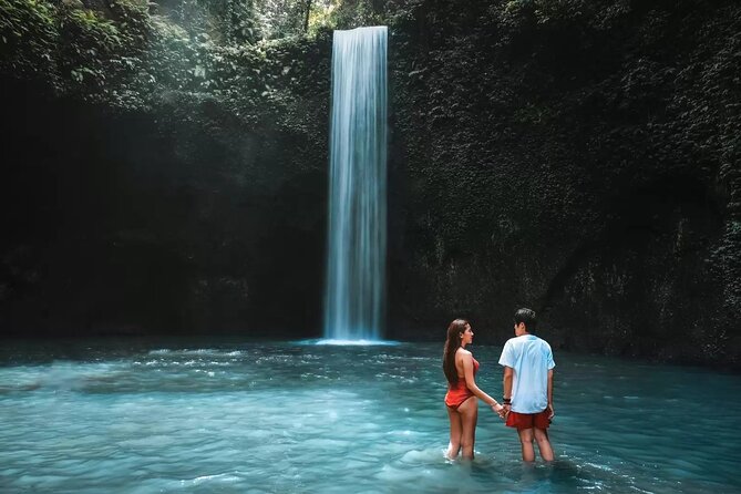 Ubud Waterfalls and Rice Terraces Private Day Tour - Tukad Cepung: Water falling through a cave
